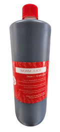 Bottle labeled 'Worm Juice' with a red cap on a white background
