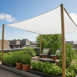 Outdoor patio with shade cloth, chairs, and potted plants on a sunny day.