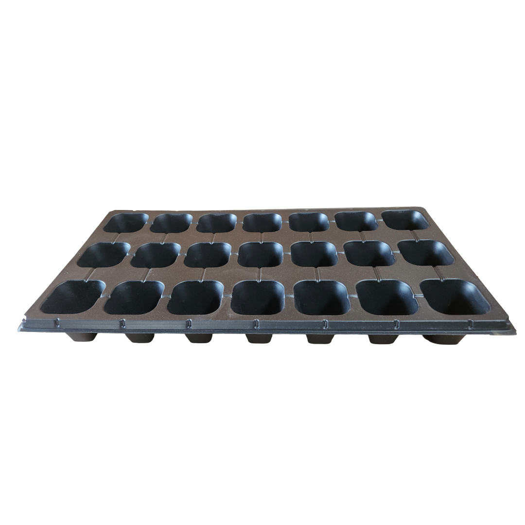 Black plastic seedling tray with multiple compartments on a white background