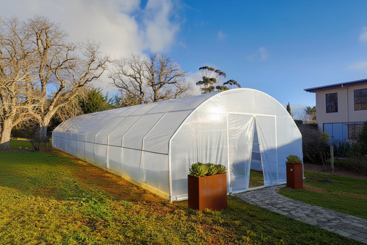 Greenhouse in a garden with a clear sky