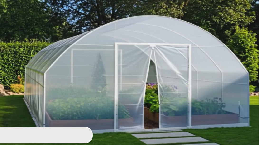 greenhouse on green grass with flowers inside